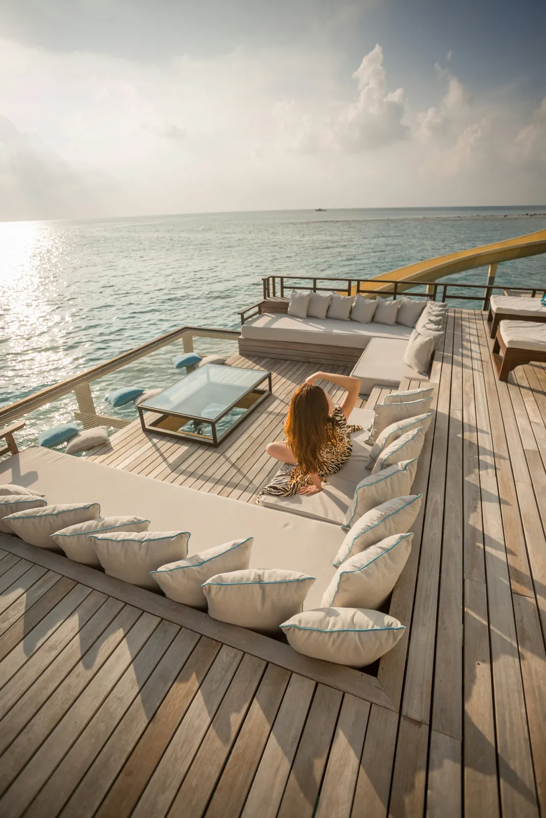 Guest relaxing on the sundeck of a superyacht